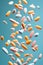 Pills and Capsules Floating on Pastel Background