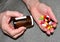 Pills in capsules in woomen hand. Medicine grade pharmaceutical tablets. Medical pill for maintaining and improving health.