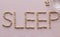 Pills laid out the word sleep, medicine, sleep problems