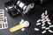 Pills, measuring scoop of amino acids powder and dumbbells on black table, flat lay