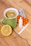 Pills, nose drops and hot tea with lemon for colds, treatment of flu and runny