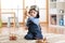 Pilot aviator child plays with wooden toy airplanes on floor in his room