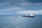 A pilot boat comes to an oil tanker