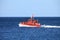 Pilot boat orange tugboat at the sea