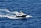 Pilot boat speeding through blue sea water