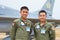 Pilot and copilot - brothers in arms. A shot of two confident asian fighter pilots.