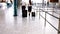 Pilot and female flight attendant walking with luggage