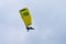 The pilot flies on a motorized parachute at a hot air balloon festival