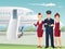 Pilot and Flight attendants of Commercial Airlines with the background of airplane.