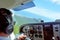 Pilot fly scenic flight above Rarotonga Island in the Cook Islands