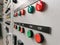 Pilot lamps and push button on low voltage switchboard.