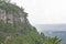 Pilot Mountain stands as a rain storm crosses the valley.