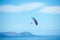 Pilot, parachute and paragliding in blue sky for flight, freedom and courage with extreme sport. Athlete, glide and