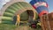 Pilot preparing to fly hot air balloon up in sky