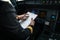 Pilot`s hand  in  a commercial airliner airplane flight cockpit during takeoff