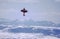 A pilot in a small Pitts bi-plane performs aerial acrobatics