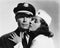 Pilot and stewardess having romantic moment