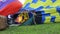 Pilots of balloon are heating the air before takeoff
