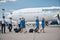 Pilots and flight attendants carrying travel bags at airport