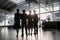 Pilots and stewardesses standing in the airport in front of the panoramic window