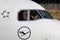 Pilots wave hands at plane spotters on board of Lufthansa Airbus A320 neo