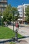 Pilsen town street with water fountain and street direction sign