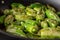 Pimientos de Padrón. Preparing Green Padron Peppers in the Frying Pan.