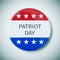 Pin button with the text patriot day