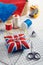 Pin cushion like Union Jack on white craft mat, sewing accessories