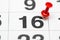 Pin on the date number 16. The Twenty second day of the month is marked with a red thumbtack. Pin on calendar