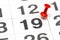 Pin on the date number 19. The Twenty second day of the month is marked with a red thumbtack. Pin on calendar