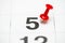 Pin on the date number 5. The fifth day of the month is marked with a red thumbtack. Pin on calendar