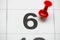 Pin on the date number 6. The sixth day of the month is marked with a red thumbtack. Pin on calendar