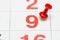 Pin on the date number 9. The ninth day of the month is marked with a red thumbtack. Pin on calendar