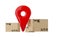 Pin location tracking marker in group of different cardboard boxes or parcels on white background, transportation, freight or