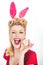 Pin-up Easter. woman in bunny ears winking. Sweet adorable girl in bunny ears celebrating Easter. Isolated white