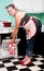 Pin-up girl in 1950s kitchen