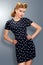 Pin-up girl in retro vintage dress posing