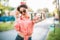 Pin up girl in sunglasses, selfie shot in park