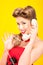 Pin-up girl talking on retro telephone