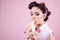 Pin up woman with trendy makeup. retro woman eating banana. pinup girl with fashion hair. pretty girl in vintage style