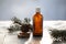pine aroma oil extract natural in cosmetic bottles aromatherapy on winter snowy background