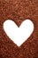 Pine bark mulch surrounding white heart symbol