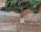 Pine border with pine cones  on rustic wood