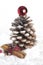 Pine cone Christmas tree and cinnamon sticks.