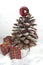 Pine cone Christmas tree and cinnamon sticks.