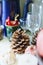 Pine cones, glass goblets, mug and flower vase on the shelf. Props in art school.