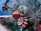 pine cones, snowflakes, peppermints, and other ornaments decorating a Christmas tree for the holiday