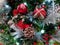 Pine cones, snowflakes, peppermints, and other ornaments decorating a Christmas tree for the holiday