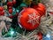 Pine cones, snowflakes, peppermints, and other ornaments decorating a Christmas tree for the holiday